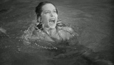 woman in pool screaming