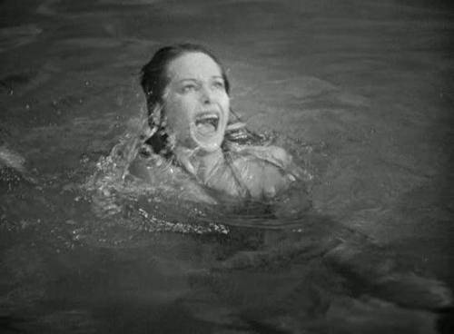 woman in pool screaming